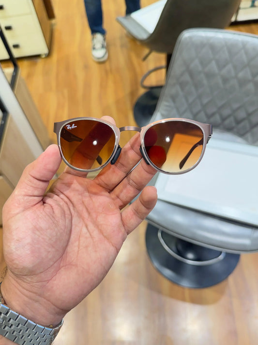 Ray-Ban RB2604 Brown Shaded - Front face-on view showing brown round frame with amber gradient lenses and Ray-Ban logo