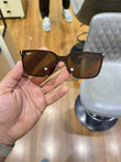 Ray-Ban RB2507S Orange Brown - Front face-on view showing dark navy frame with warm brown lenses and Ray-Ban logo