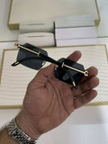Dark smoke rimless square sunglasses - flat lay front view
