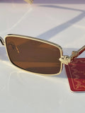 Gold rectangular sunglasses with brown lenses - 3/4 angle view with Cartier red box and card
