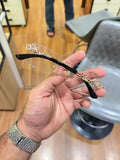 Rimless gold panther body bridge eyeglasses - front view showing clear plano lenses and full gold panther bridge
