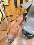Amber rimless sunglasses - temple detail with panther and red gem accents