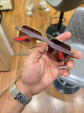 Ray-Ban x Ferrari RB4406M Gold Brown - Folded display showing mauve grey temples and red Ferrari tips