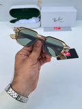 Ray-Ban RB1115 Brown Green - Hand holding folded frame showing gold rivet temple detail