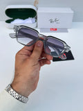 Ray-Ban RB1115 Grey Shaded - Hand holding folded frame showing silver rivet temple detail